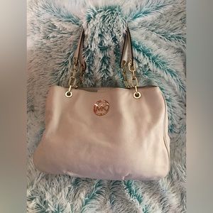 Michael Kors MK Off-white purse with three compartments center zip/magnet.